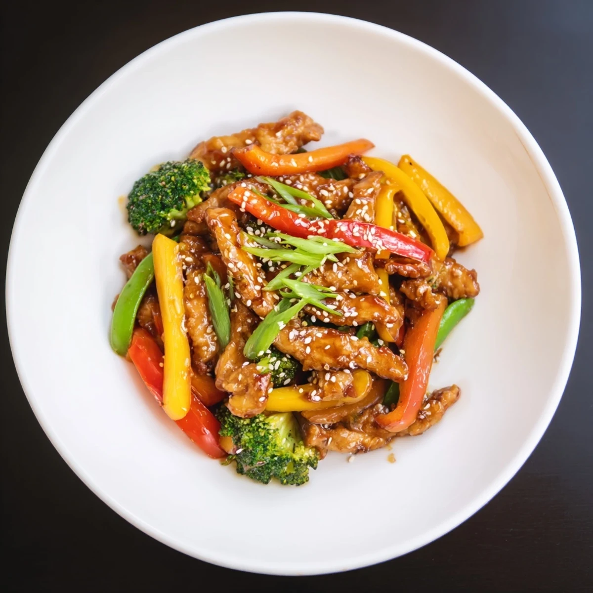 Savory Chicken Stir-Fry with colorful veggies, ready to serve with fluffy jasmine rice.