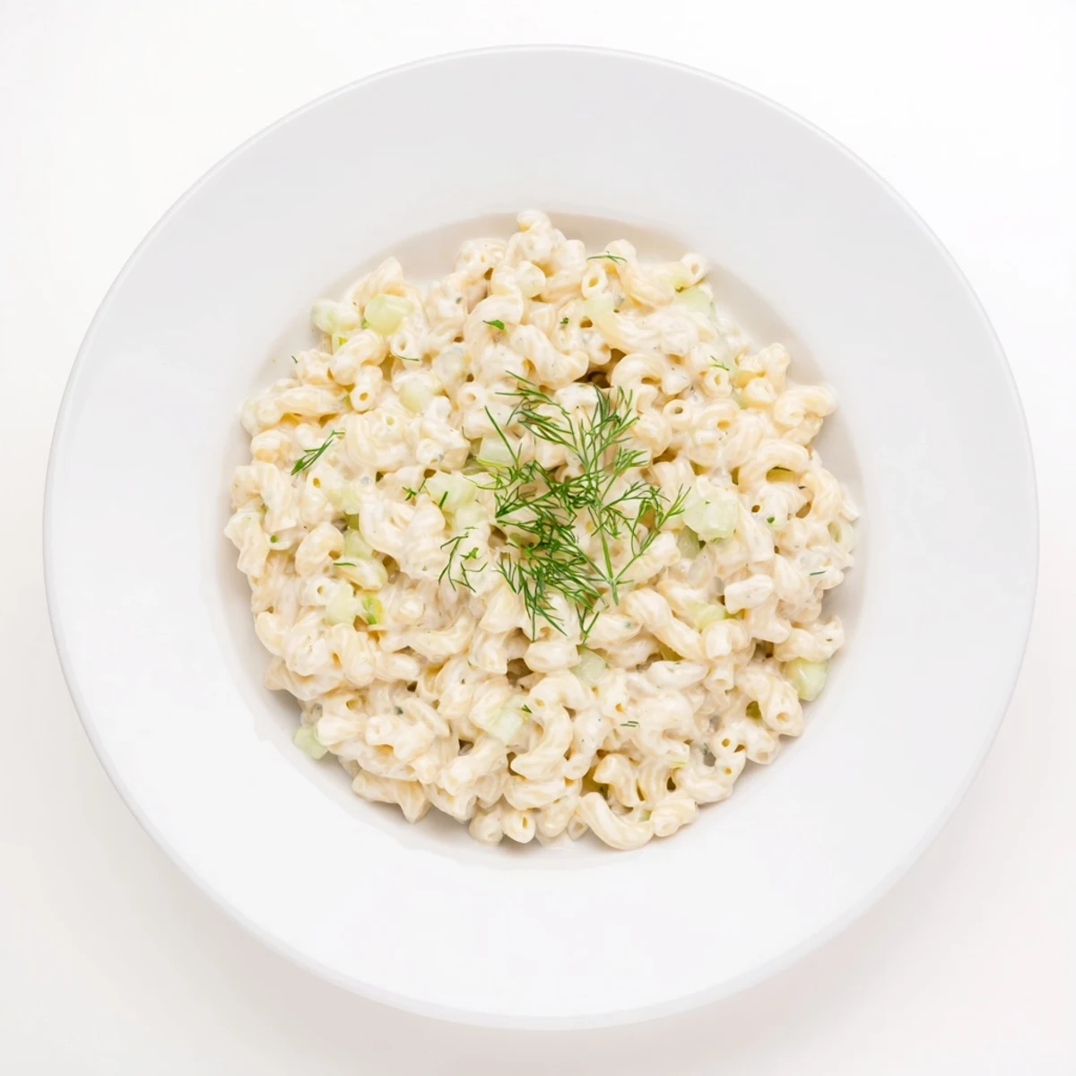 Golden, bubbly Pickle Mac and Cheese, with a generous sprinkle of fresh dill ready to serve.