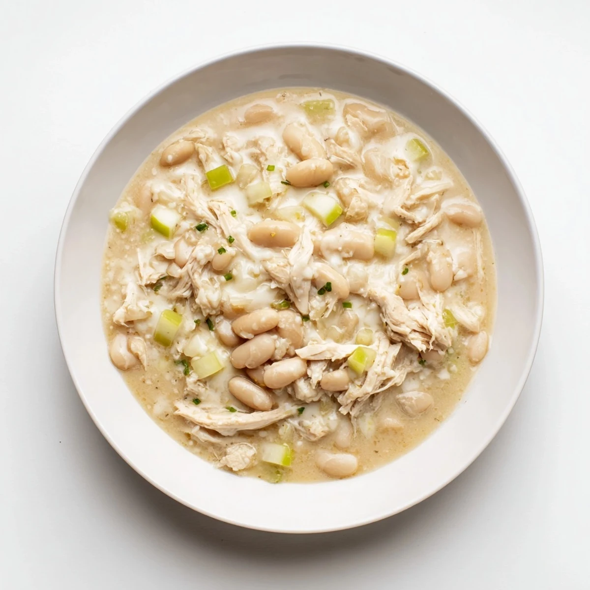 A warm, inviting shot of creamy 35-Minute White Cheddar Apple Chicken Chili, ready to be enjoyed.