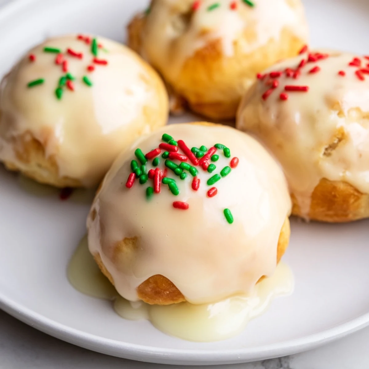 Festive Quick Christmas Biscuit Bombs, arranged beautifully on a plate, ready to be enjoyed with hot cocoa.