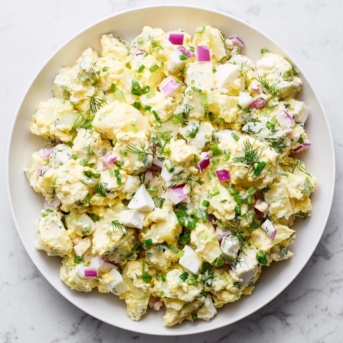 This Chopped Egg and Potato Salad shows off perfectly diced potatoes mixed with flavorful dressing.