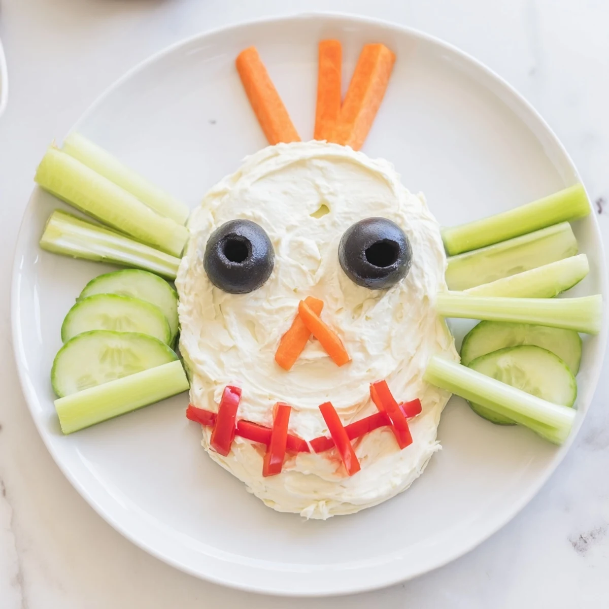 Festive Skull & Bones Spooky Spread appetizer arranged on a platter with crunchy vegetable features for Halloween.