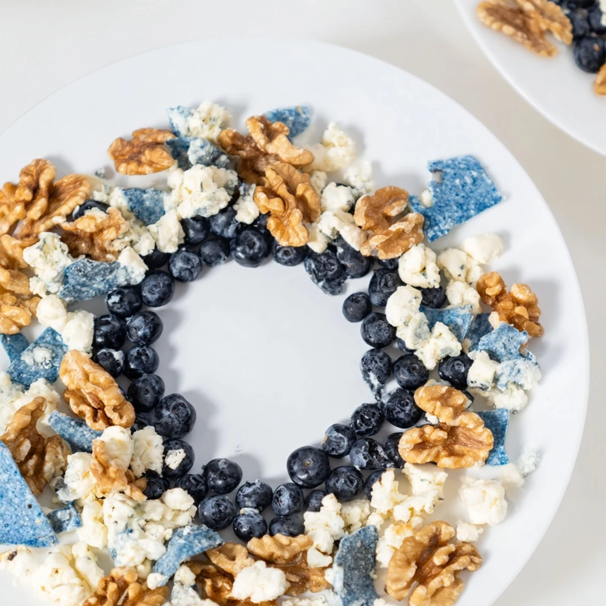 Vibrant arrangement of The Olympic Rings Interlock appetizer, featuring fresh ingredients in interlocking rings on a platter.