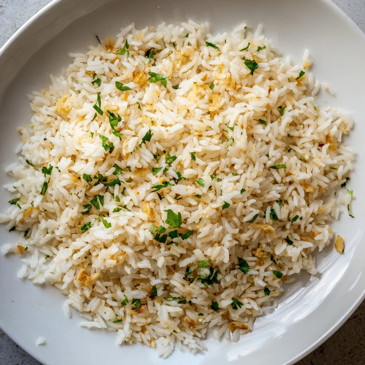 Fluffy, fragrant Jasmine Rice Garlic; a comforting side dish with glistening garlic, ready to serve with your favorite Asian entrees.