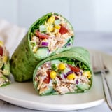A close-up of BBQ Chicken Salad Wrap halves, revealing creamy chicken salad and vibrant, crunchy vegetables.
