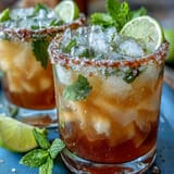 A refreshing Cinco de Mayo Margarita Mocktail with lime and salt rim, perfect for festive celebrations and non-alcoholic enjoyment.