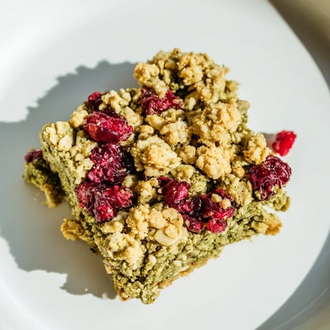 Golden, crumb-topped Matcha Cranberry Oat Crumble Bars, delicious and perfect for a quick breakfast.