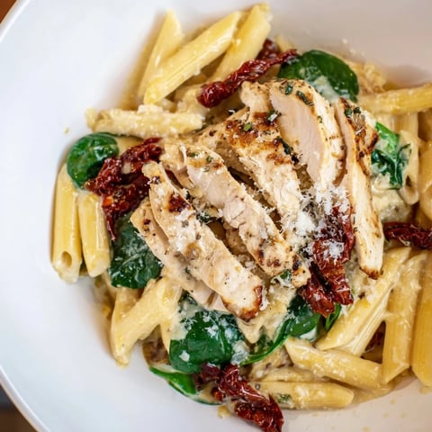 Creamy Tuscan Chicken Pasta with tender chicken, spinach, and sun-dried tomatoes, a comforting Italian meal.