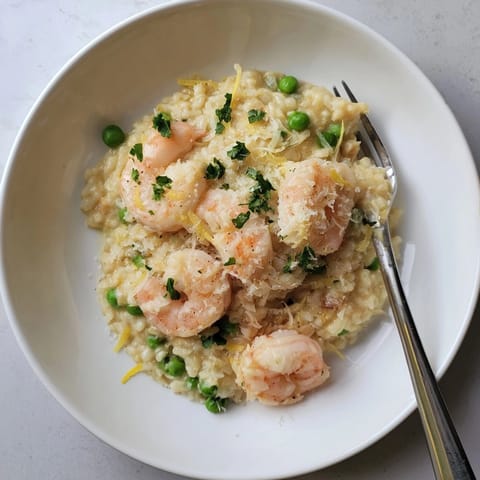Imagine a cheesy, savory Shrimp Parmesan Rice Skillet, hot and ready to serve.