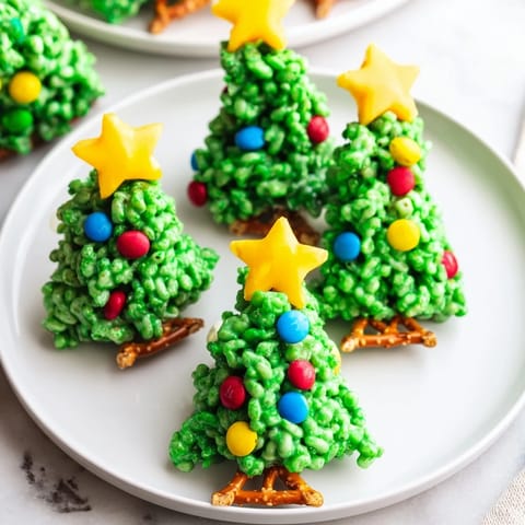 Green-tinted Christmas Tree Rice Krispy Treats ready to eat, a fun and easy holiday snack.