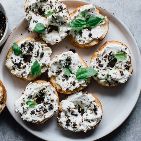 A platter of the Olympic Rings Medal Appetizer: mini bagels topped with vibrant, color-coded cream cheese.