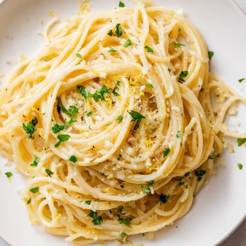 Delicious Garlic Butter Noodles with fresh parsley and Parmesan cheese, perfect for a quick dinner.