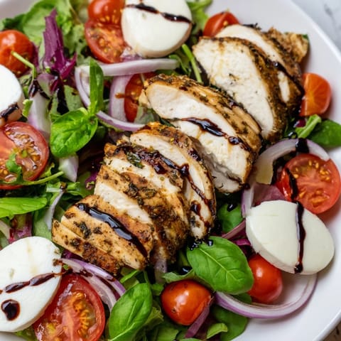 Delicious Caprese Chicken Salad: a vibrant Italian salad with grilled chicken and fresh basil.