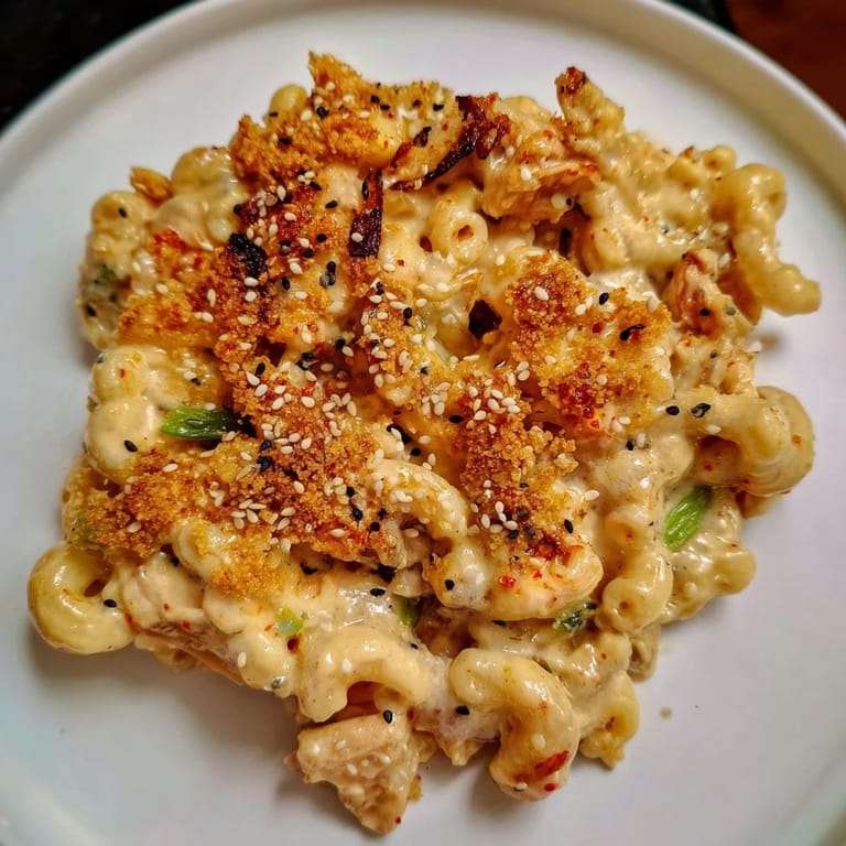 Savory Spicy Kimchi Mac & Cheese garnished with panko and sesame for added texture.