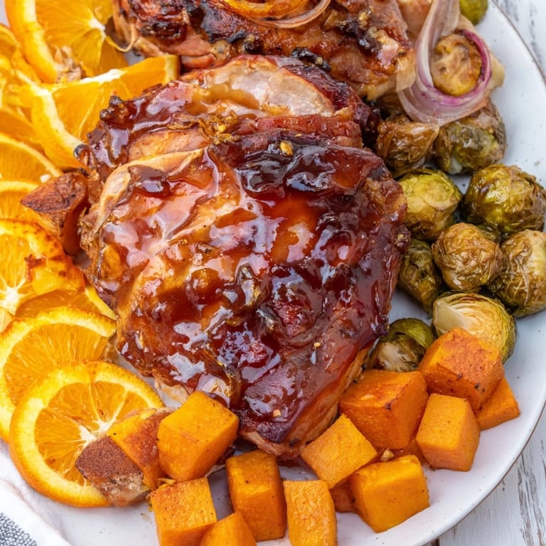 A close-up of the Sheet-Pan Roasted Turkey Breast showcases crispy skin and roasted vegetables.