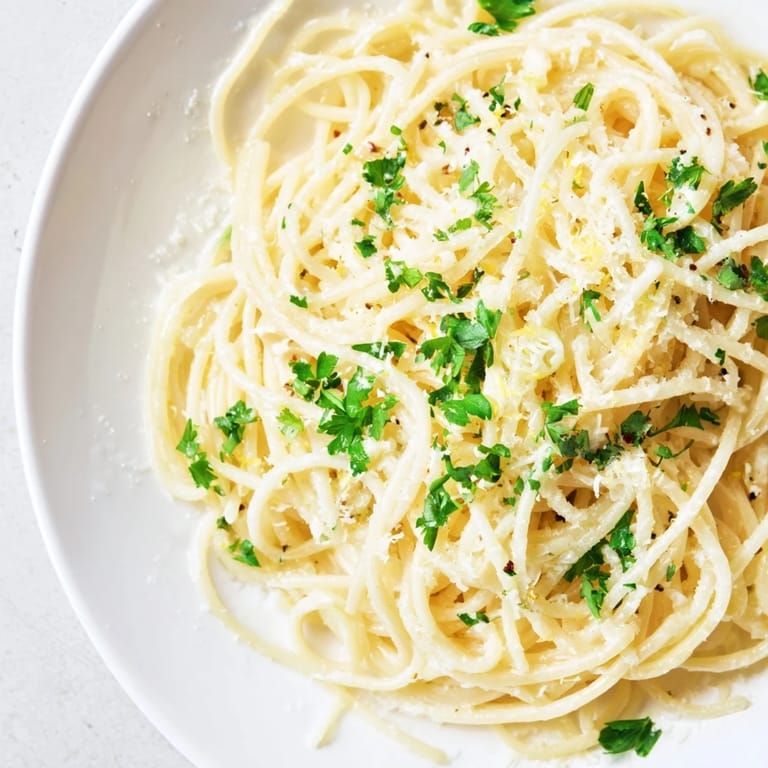 Tender spaghetti enveloped in rich garlic butter sauce, a flavorful Garlic Butter Noodles recipe.