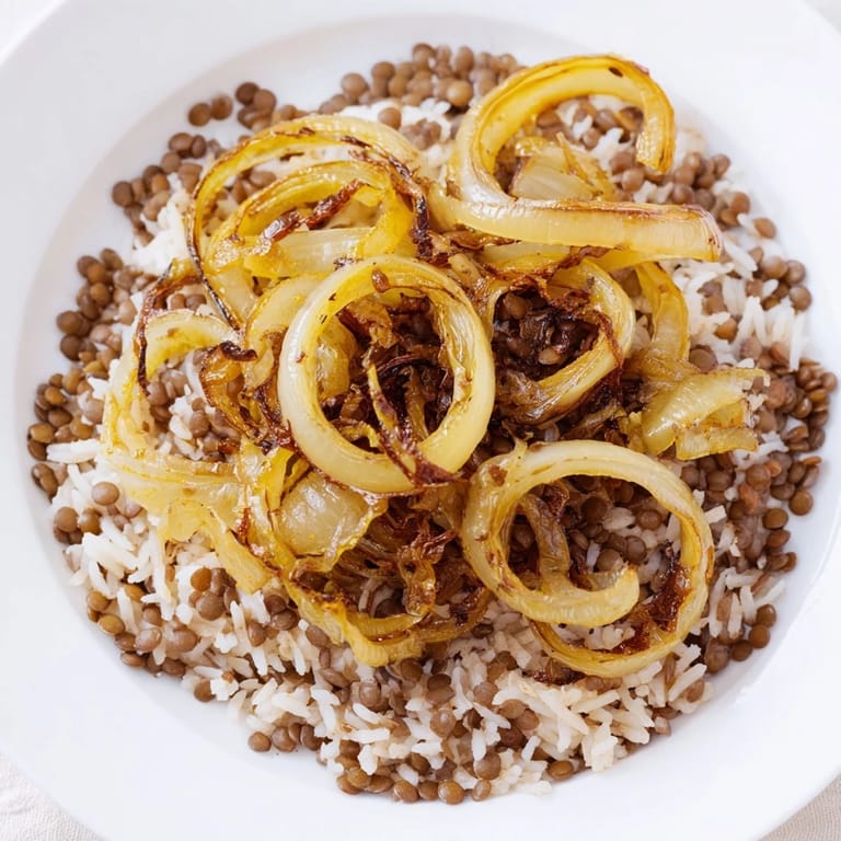 This hearty bowl of Lebanese Mjadra shows off the perfect marriage of lentils, rice, and golden onions.