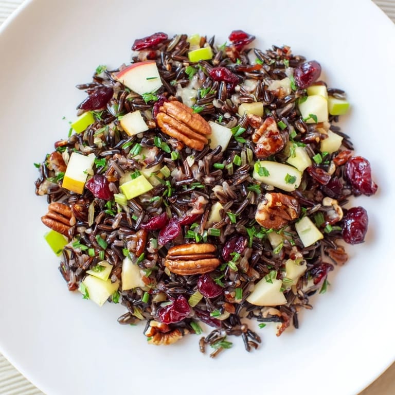 Enjoy the inviting texture of this Wild Rice Harvest Salad, tossed with fresh herbs and crunchy pecans.